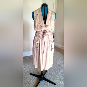 Sleeveless, utility style, shirred waist dress with self tie belt.